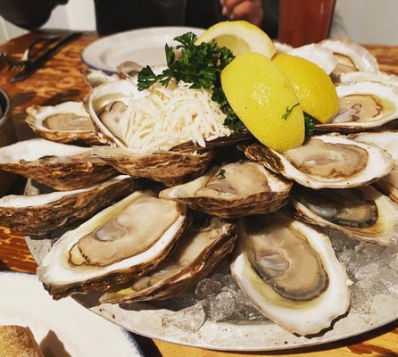 Photo of Rodney's Oyster House - Vancouver, BC, CA. a platter of oysters