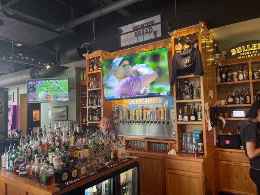 Photo of City Tavern - Columbus, OH, US. a man and a woman standing in front of the bar