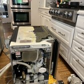 Miele dishwasher circulating pump replacement in progress