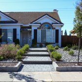 Paver stepped walkway, paver bordered planter area, floating concrete, and lots of softscaping.