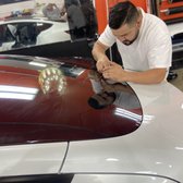 Our installer molding the window tinting film