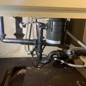 Repair leak under sink with garbage disposal