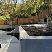 New concrete & redwood fence.