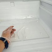ice buildup at the bottom of the fridge