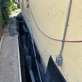 Installing waterproofing membrane and backfilling French drain in Berkeley ca