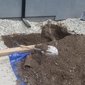 Main sewer pipe exiting fountain of home dug up and exposed.