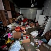 Garage was cleared of items and the wall cabinets were dismantled and removed.