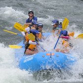 Rafters splashing through rapid