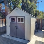 Shed assembly. The concrete was previously laid.