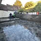 Pavers are installed with a flat area for new shed and grading to direct the water away from house. Amazing work