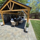 Finished fireplace, pergola, and pavers