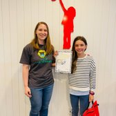 Our dedicated teacher and student who earned her first certificate and wristband! We offer unique reward system that can only be found here!