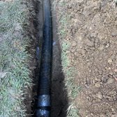 After clearing a clogged drain we put together the new solid Corrugated drain pipe.