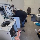 Technician Joe rebuilding washing machines