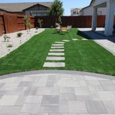 Showcasing a vast 900 sqft of lush, green turf, this photograph highlights the seamless integration of natural elements within the design. 