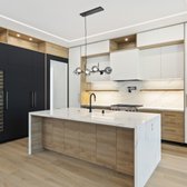 Kitchen remodel with hidden refrigerator, along with matching wine cooler gives this kitchen an ultra luxury look and feel. 