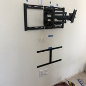 TV and fireplace mount installation. Running wires behind the wall.