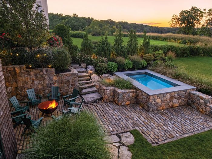 A plunge pool with a stone finish