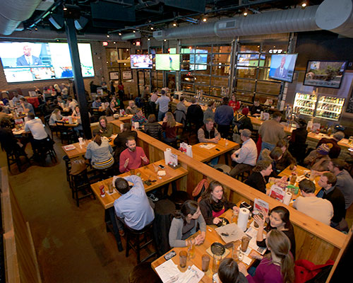 Double Dogs Hillsboro Village interior with big TVs.