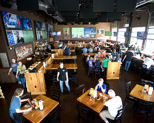 Double Dogs Middletown interior with big TVs.