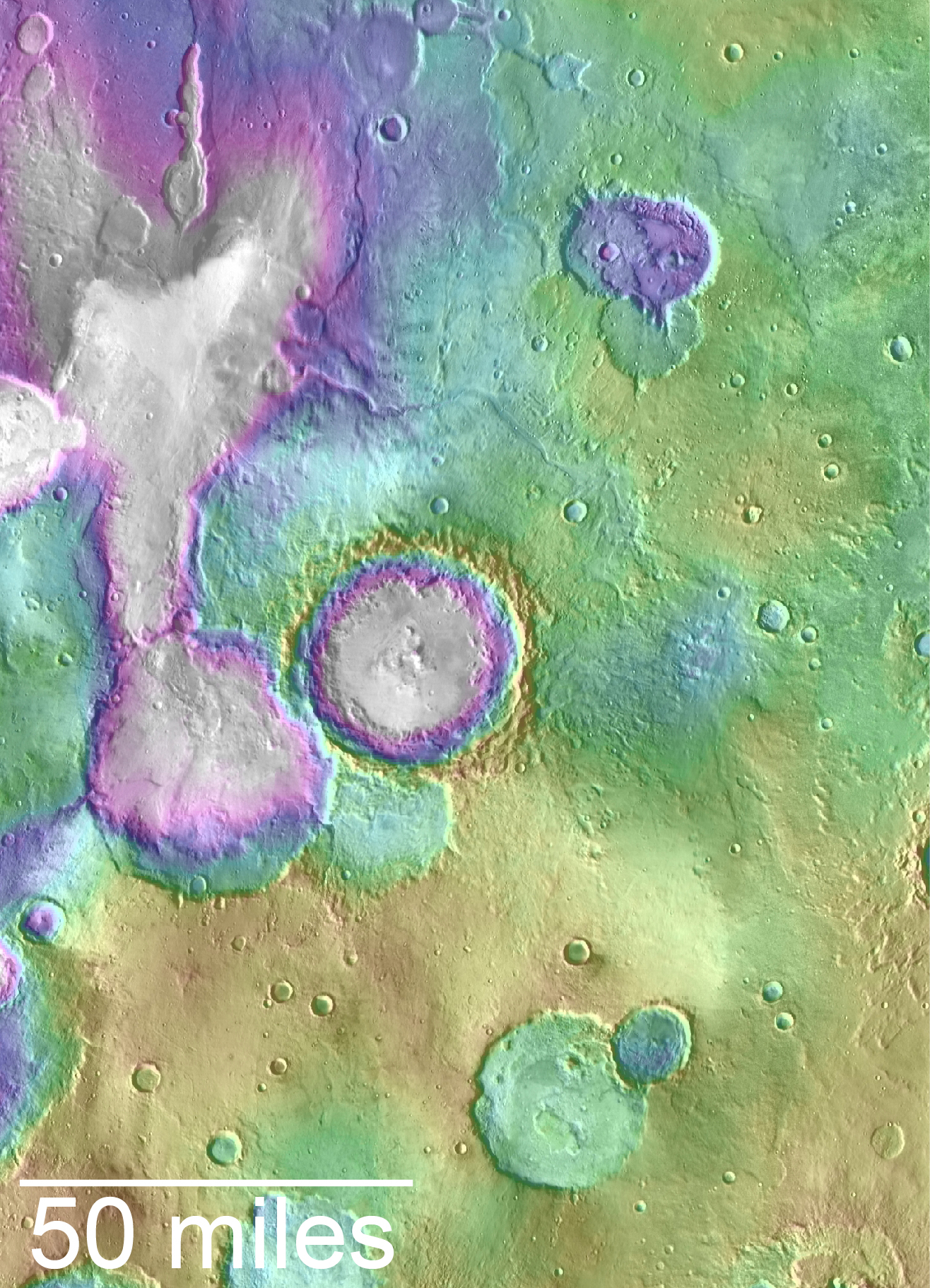 An overhead landscape the looks like a painting covered in thick globs and spots of paint – a field of light blue-green in the upper right quarter, with a lavender spot in its middle, the lower half is a light olive green, with smudhes of white, and blue-green, and the upper left quarter is mostly shades of purple and very light gray, with smudges of green encroaching. Text at the bottom left shows the bottom edge of the scene is 50 miles across.