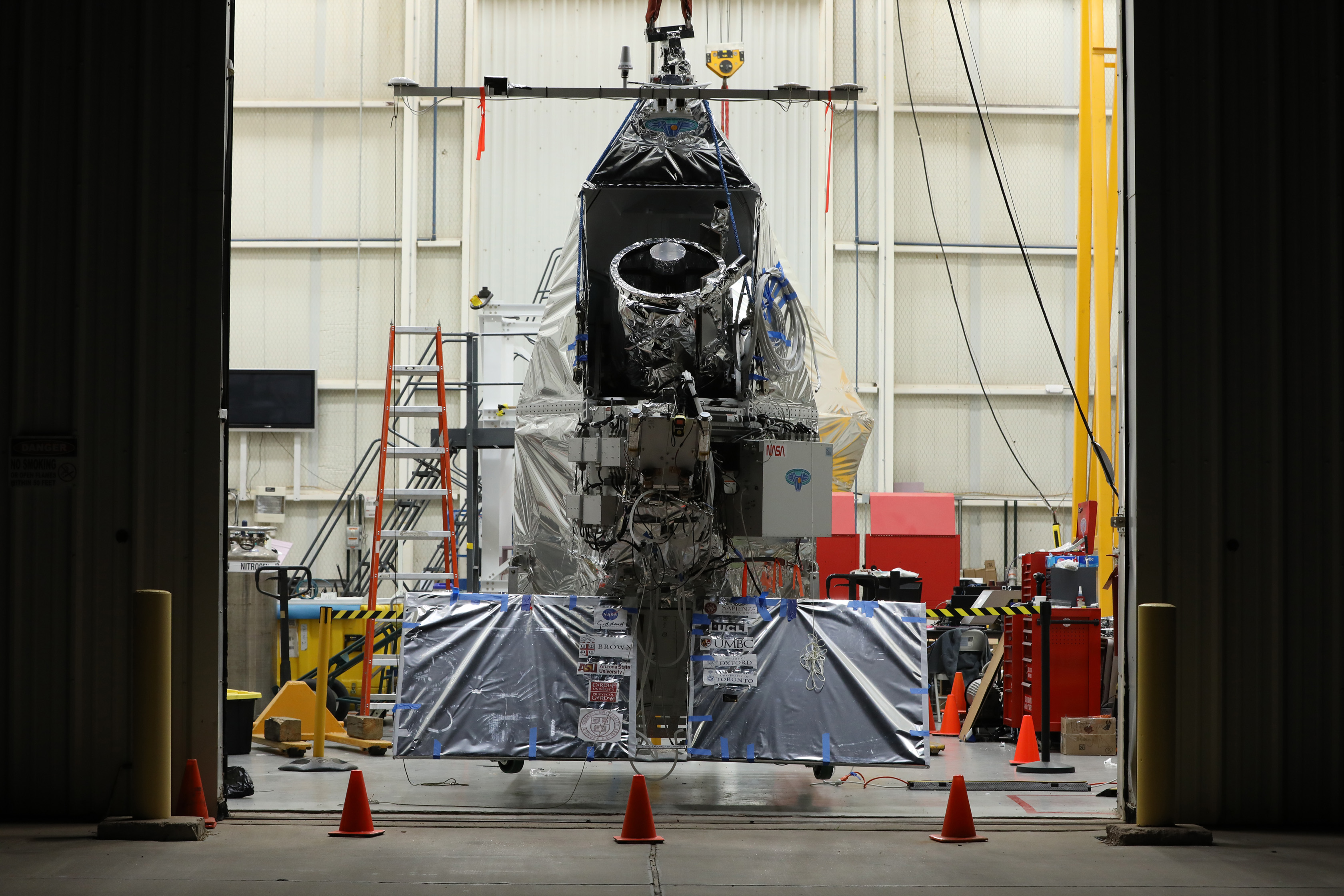 Photo of a telescope in a hanger.