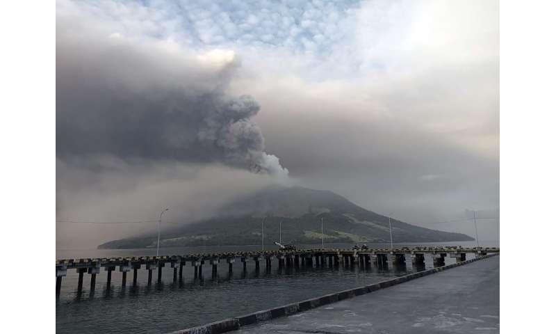 More than 2,100 people are evacuated as an Indonesian volcano spews clouds of ash