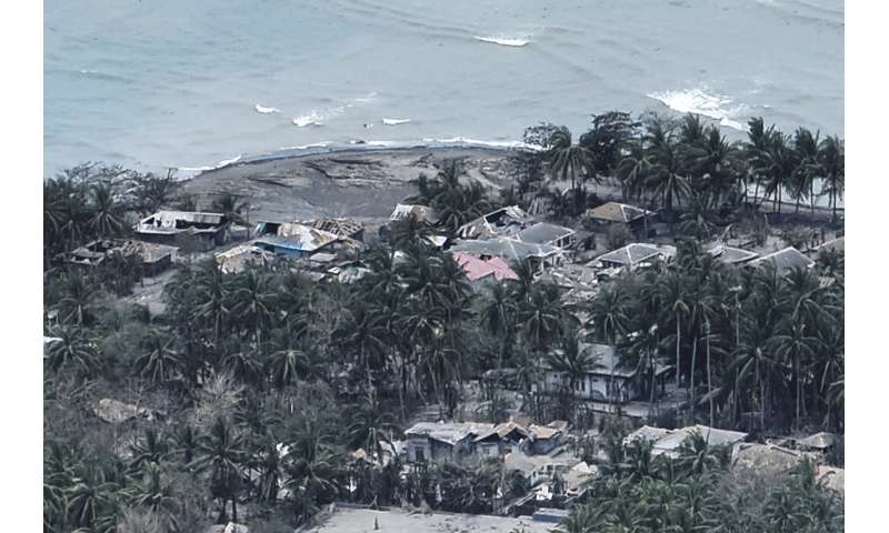 More than 2,100 people are evacuated as an Indonesian volcano spews clouds of ash