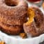 This Easy Baked Pumpkin Donuts Recipe is the perfect way to celebrate the start of fall. Tender, perfectly spiced donuts smothered in either a maple glaze or cinnamon sugar! showmetheyummy.com #bakeddonuts #pumpkindonuts