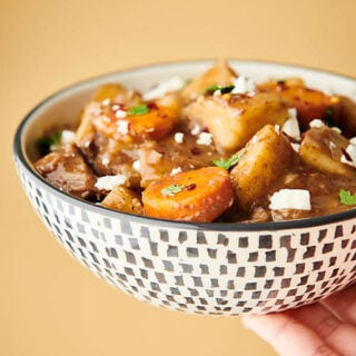 This Slow Cooker Beef Stew is SO easy to make. It's the perfect cozy, hearty fall meal! Loaded with chuck roast, veggies: onion, potatoes, carrots, and celery - beef broth, red wine (optional), and spices! A stick-to-your-ribs meal made healthier! showmetheyummy.com #slowcooker #crockpot #beefstew