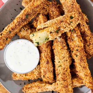 air fryer pickles on a plate with ranch