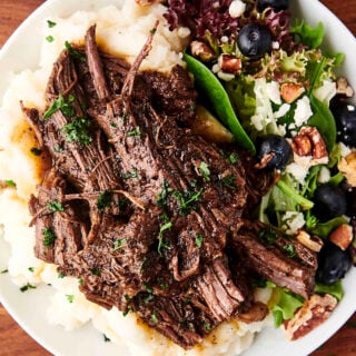 braised beef served with potatoes and salad