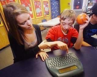 child works at keyboard