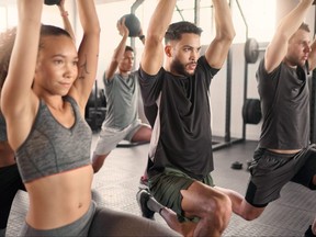 People work out at a gym.