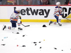 Leon Draisaitl #29 and Ryan Nugent-Hopkins #93 of the Edmonton Oilers react to the loss of Game Seven of the 2024 Stanley Cup Final at Amerant Bank Arena on June 24, 2024 in Sunrise, Florida. The Florida Panthers defeated the Edmonton Oilers 2-1 to win the Stanley Cup.