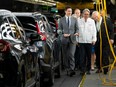 Prime Minister Justin Trudeau, left, and Ontario Premier Doug Ford, right, tour a Honda manufacturing plant in Alliston, Ont., on April 25, 2024.