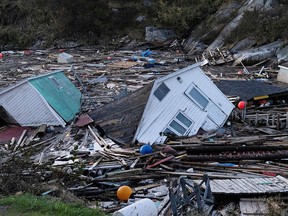 Houses float in the water in the aftermath of Hurricane Fiona in Rose Blanche, Newfoundland. Damages will likely produce record insured losses in Atlantic Canada.