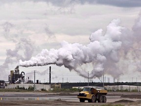 A dump truck works near an oil sands extraction facility near Fort McMurray, Alta.