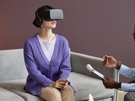 Young woman wearing virtual reality headset when having therapy session