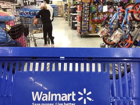 Customers shop for food at Walmart in Salem, N.H., Monday, June 5, 2017.