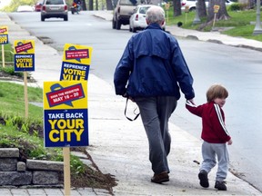 Pro "demerger" signs line Grosvenor Ave. in Westmount in May 2004.