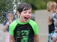 Summer days should be carefree for all kids. Mason Ineson, 7, was clearly happy with the cooldown at the Barrhaven splash pad last summer.