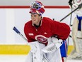 Canadiens prospect Jacob Fowler is seen bending at the waist in his full goalie gear with his mask atop his head and a big smile on his face during Montreal's rookie development camp in Brossard.