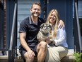Former Alouettes quarterback Tanner Marsh with wife, Chelsey Narvey, and their dog Whiskey sit on the steps at her brother’s home in St-Laurent. The couple are expecting their first child, a daughter, in November.