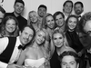 Black and white photo of Brendan Gallagher with his wife and teammates at his wedding