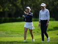 Sisters; Maddie Szeryk, left, and Ellie Szeryk, of Canada, walk together on the first hole while paired together during the first round at the LPGA CPKC Canadian Women's Open golf tournament, in Vancouver, on Thursday, August 24, 2023.