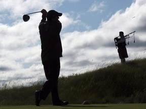 Caledon, Ont., is preparing to welcome the world -- through the RBC Canadian Open -- to its rolling green hills. Golf course architect Doug Carrick tees off as bagpiper Kristen MacKay stands by the first tee during the Osprey Valley Heathlands 25th anniversary celebration in Caledon, Ont., Tuesday, July 25, 2017.