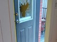 The back door of a home in Montreal's Chinatown neighbourhood had its window smashed in by a brick by a man who then wielded a knife and a fire extinguisher on July 11, 2024.