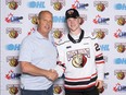Owen Sound Attack GM Dale DeGray with newly signed forward Easton Mikus. Photo courtesy of Attack Hockey.