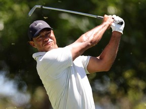 Tiger Woods of the United States plays his shot from the fourth tee during the third round of the 2024 Masters Tournament at Augusta National Golf Club on April 13, 2024 in Augusta, Ga.